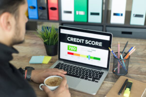 credit score on laptop screen in office